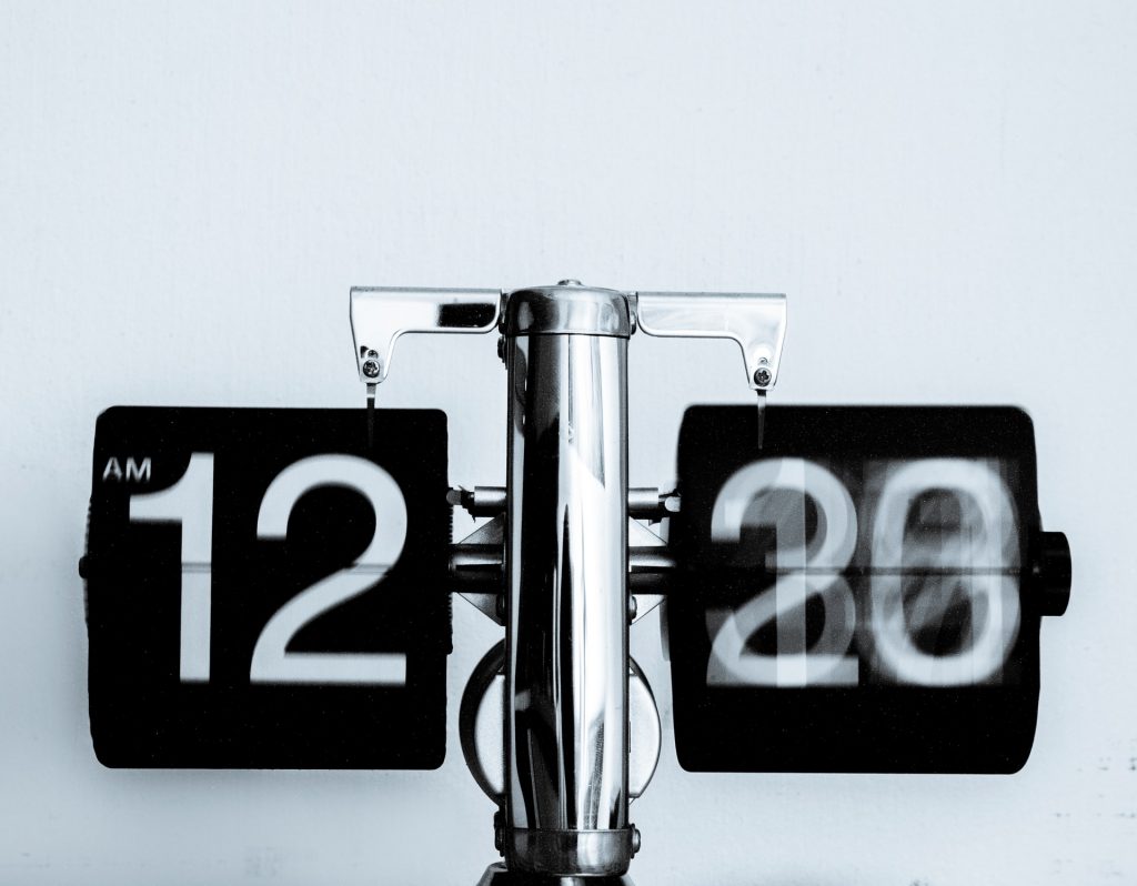 A blurry clock to symbolise time passing quickly. 