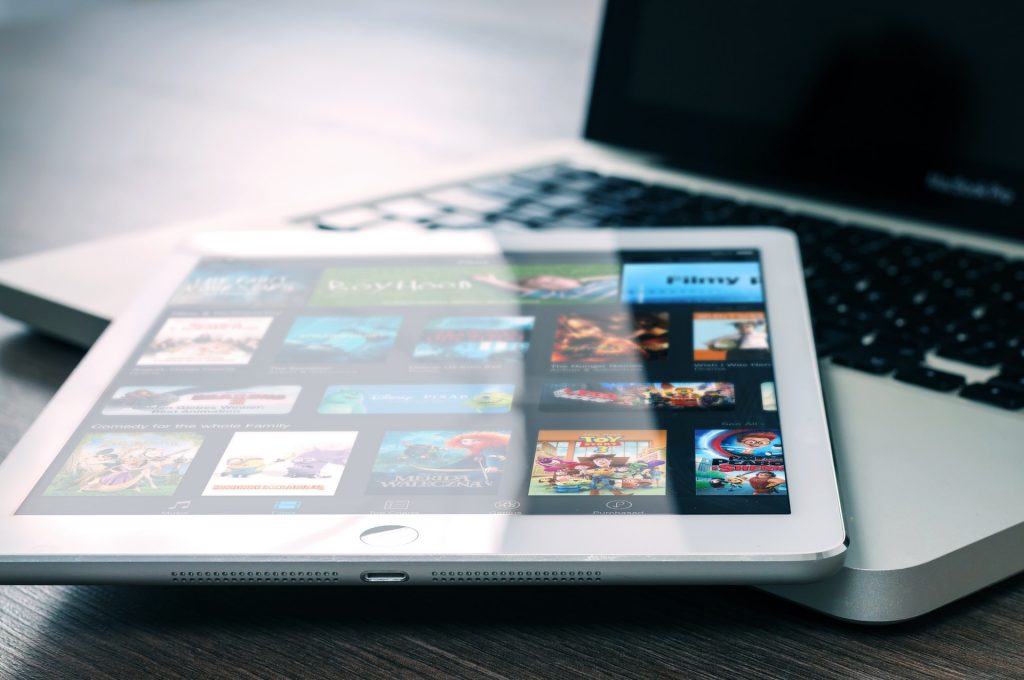A laptop and iPad displaying SRF's media library.