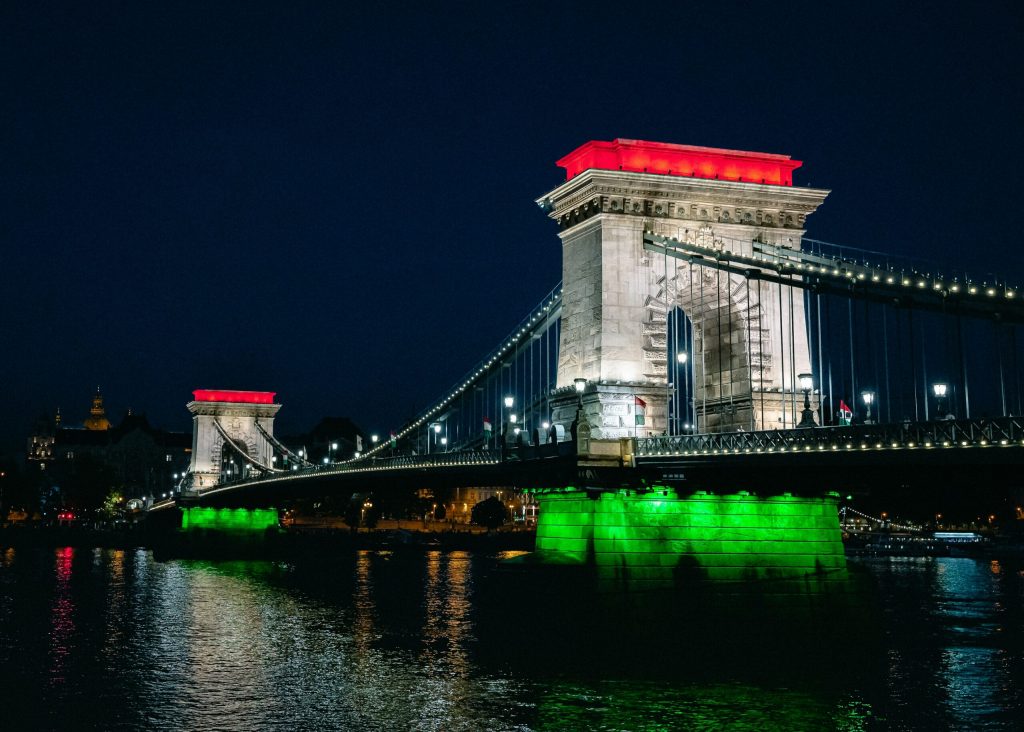 A bridge in Budapest with the Hungarian flag highlighted.